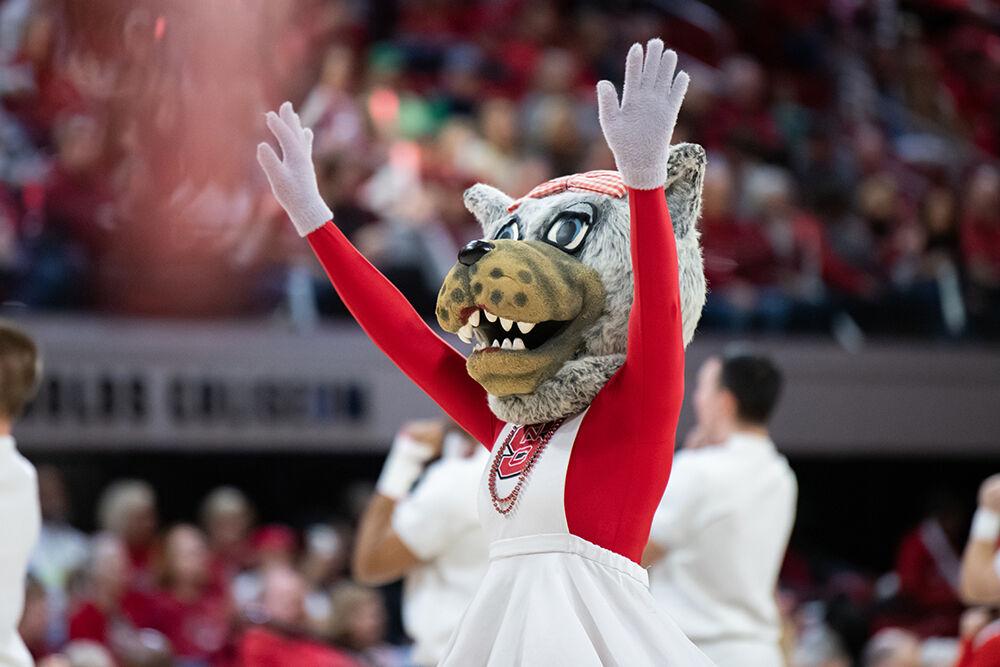 Mrs. Wuf cheers during a timeout during the game versus Notre Dame at Reynolds Coliseum on Sunday, Jan. 29, 2023. the Wolfpack beat the Fighting Irish 69-65.