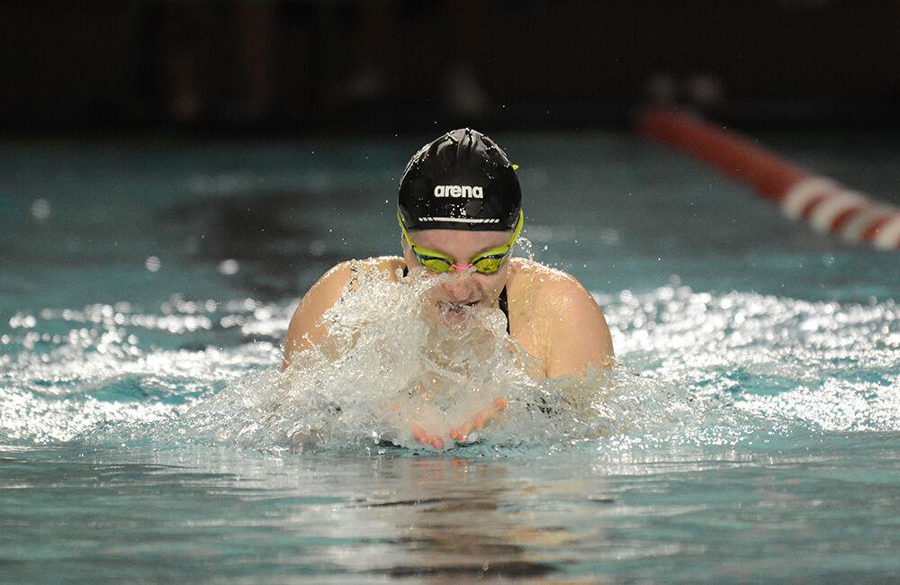 Sophomore Kaylee Hamblin comes up for air in the women's 100-yard breaststroke during the NC State Wolfpack's swimming and diving meet against the North Carolina Tar Heels and Virginia Cavaliers. Hamblin placed second with a 1:01.94. The Wolfpack women beat the Tar Heels 243-110 and lost to the Cavaliers 130-223.