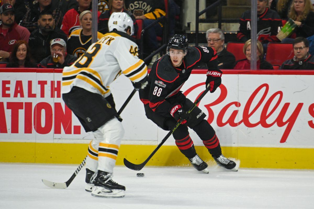 Carolina Hurricanes center Martin Necas dekes the puck in front of a Bruins player during the game against Boston in PNC Arena on Sunday, Jan. 29, 2023. The Hurricanes beat the Bruins 4-1.
