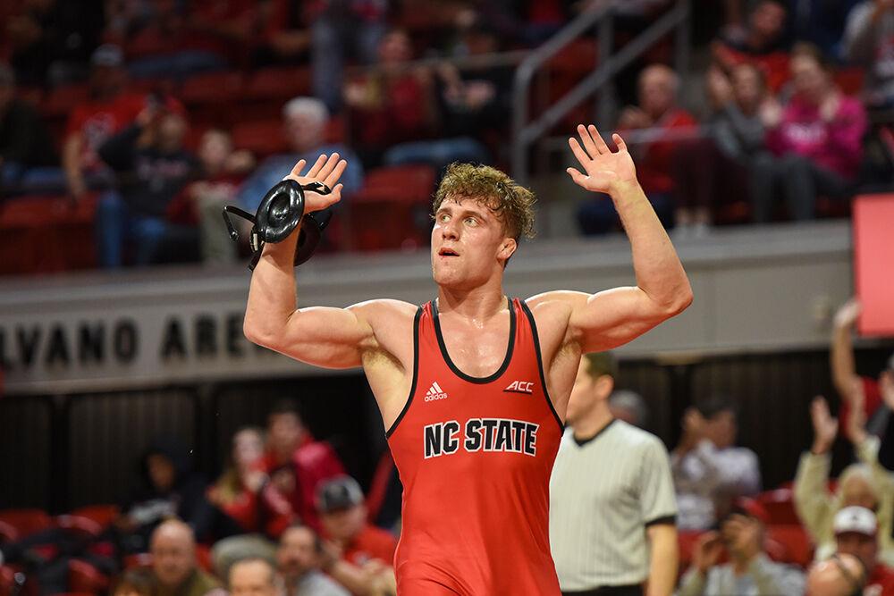 Redshirt junior Trent Hilday celebrates winning the 184 bout against the Binghampton Bearcats in Reynolds Coliseum on Friday, Jan. 6, 2023. Hilday won his individual match 13-4. NC State beat Binghampton 36-3.