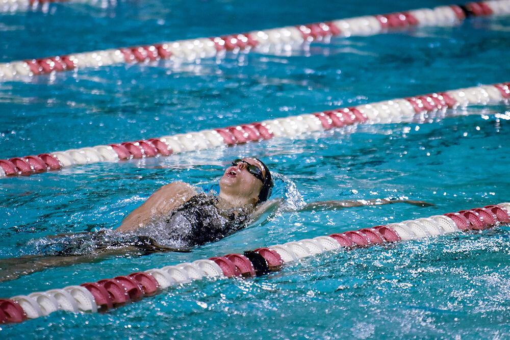 Junior Katey Lewicki takes a breath in the women's 200-yard backstroke during the NC State Wolfpack's swimming and diving meet against the UNC-Wilmington Seahawks at the Willis R. Casey Aquatic Center on Friday, Jan. 27, 2023. Sheble placed first in the heat with a 1:55.39. The Wolfpack women beat the Seahawks 186-105.