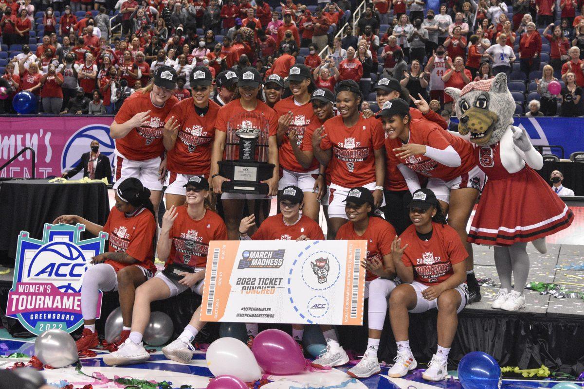 The team poses for pictures after the ACC championship game against the University of Miami on Sunday, March 6, 2022 inside Greensboro Coliseum. NC State won the game 60-47.