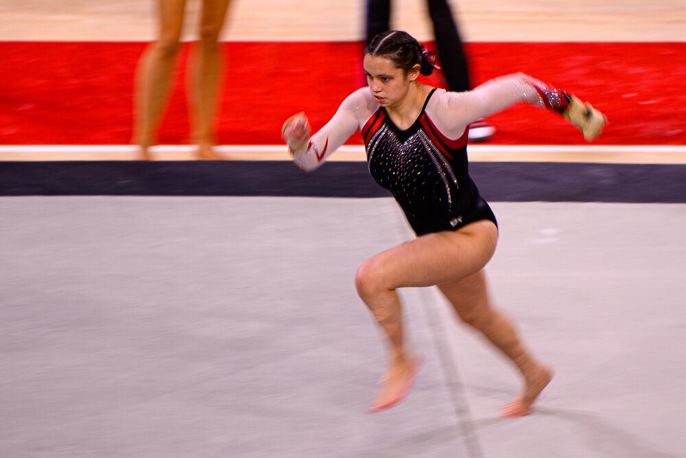 Sophomore Chloe Negrete performs her floor routine on Saturday Feb. 27, 2021 at Reynolds Coliseum. Negrete tied the highest-scoring floor routine with a 9.875. The Wolfpack took first place in the tri-meet over North Carolina and Temple with a score of 196.200.