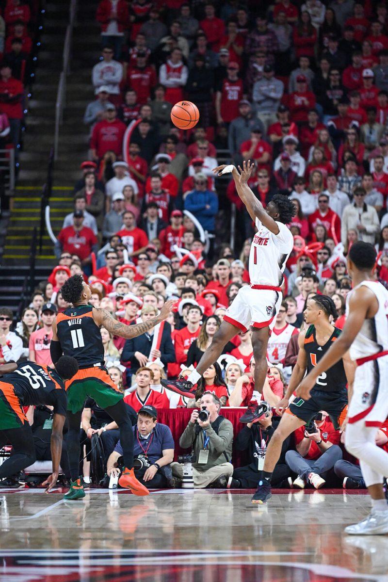 Graduate guard Jarkel Joiner shoots the ball during the game against Miami in PNC Arena on Saturday, Jan. 14, 2023. Joiner had 11 points and three assists for NC State. The Wolfpack won 83-81&#160;in overtime.