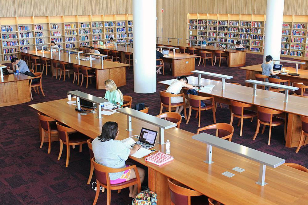 Students work in the quiet reading room June 19, 2015. The room, located on the second floor of Hunt Library, is well-lit and has large tables, perfect for spreading out notebooks and textbooks during any study session.