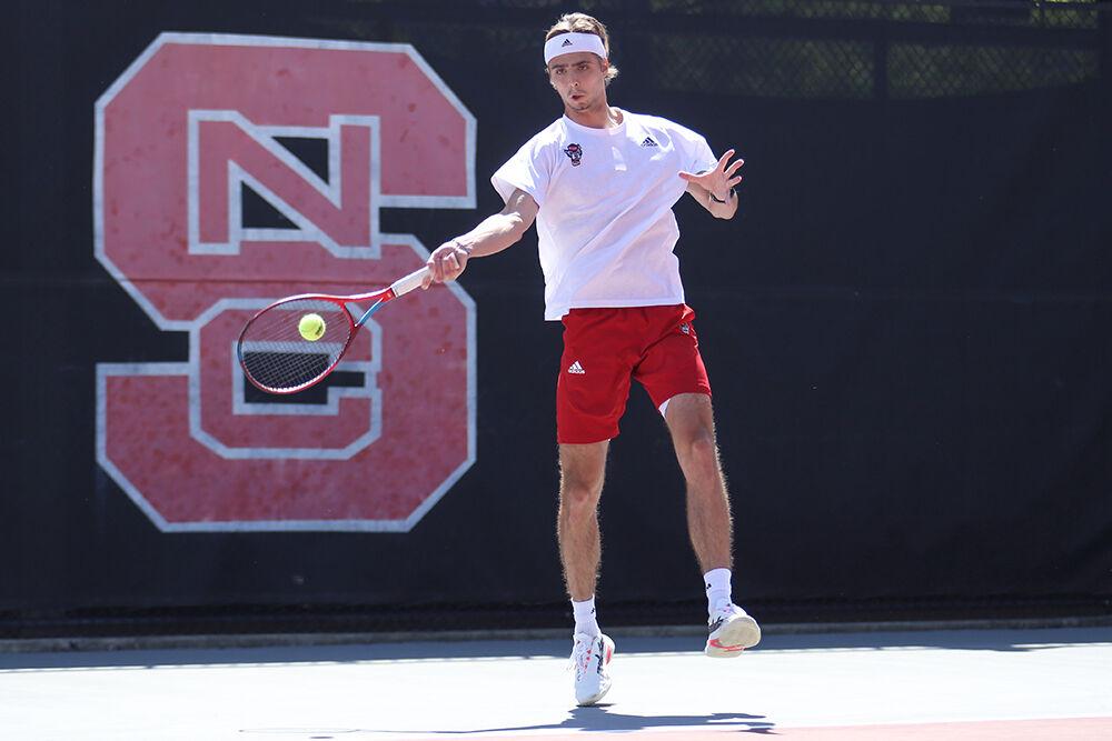 Junior Robin Catry forehands the ball during the match against UNC-Chapel Hill on Sunday, April 17, 2022 at J.W. Isenhour Tennis Center. The Wolfpack lost 4-3.