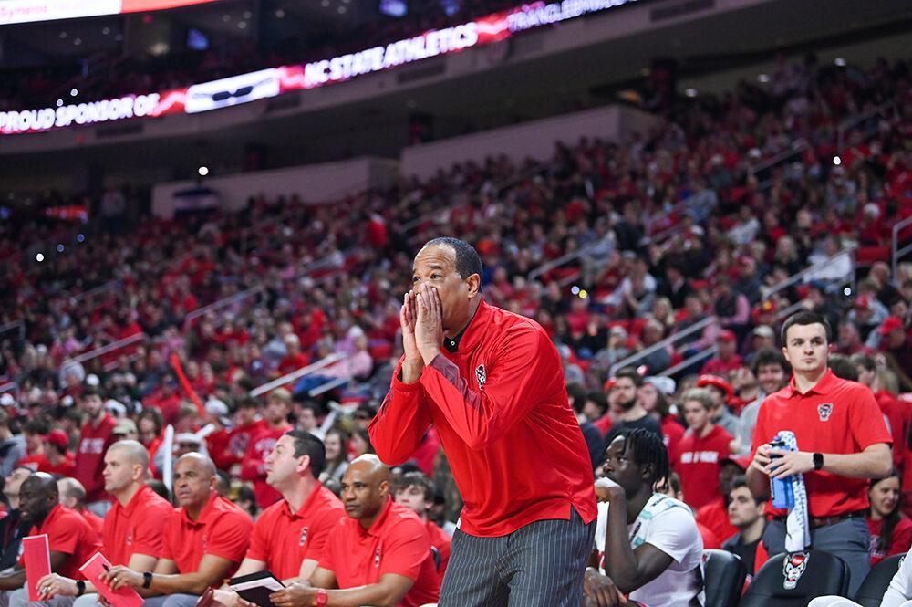 NC State head coach Kevin Keatts communicates with his players during the game against Miami in PNC Arena on Saturday, Jan. 14, 2023. The Wolfpack won 83-81&#160;in overtime.