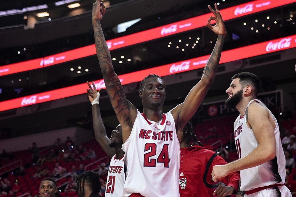 Sophomore forward Ernest Ross celebrates after his teammate scored during the game against Austin Peay State University in PNC Arena on Monday, Nov. 7, 2022. Ross scored 6 points. The Wolfpack beat the Governors 99-50.