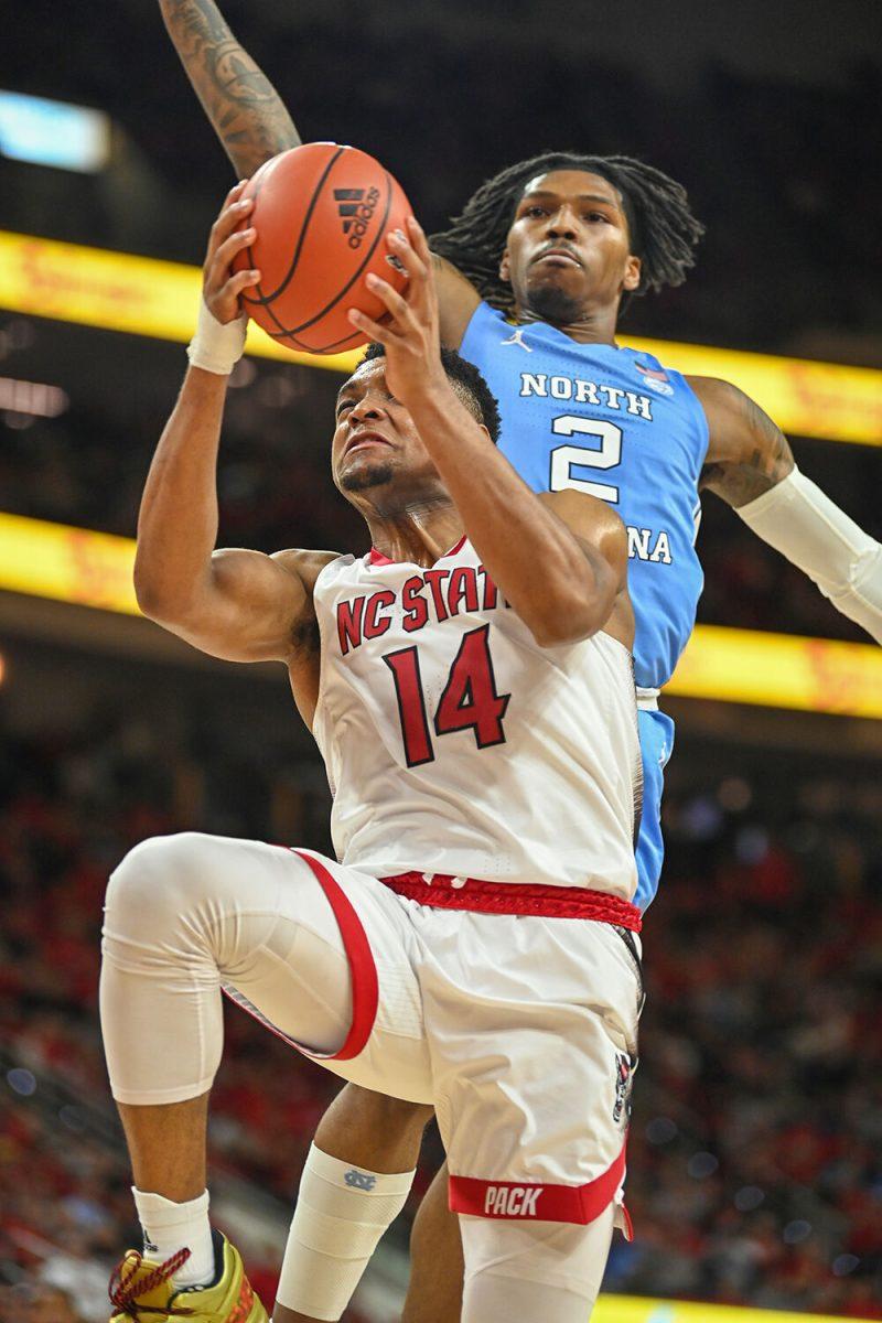 Senior guard Casey Morsell shoots the ball during the game against UNC-Chapel Hill in PNC Arena on Sunday, Feb. 19, 2023. Morsell had 12 points for NC State. The Wolfpack beat the Tar Heels 77-69.
