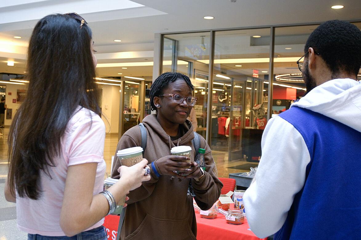 Dejah Headen, a second-year studying psychology, Rebecca Hernandez, a second-year exploratory studies student, and Adonis Belton, a fourth-year studying psychology, share a conversation at the Black History Month Kickoff in Talley Student Union on Feb. 1, 2023. The theme for this year's black history month is Black Euphoria.