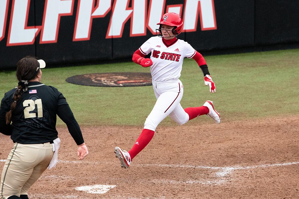 Junior infielder Kaylee Lambrecht jumps to home base during the game versus Purdue at Dale Softball Stadium on Sunday Feb. 19, 2023. Lambrecht scored one run for the Wolfpack. NC State beat Purdue 4-3.