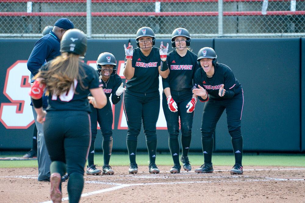 Graduate third baseman Logan Morris runs towards home plate as her team celebrates her home run during the game against UNC-Charlotte on Wednesday, March 30, 2022 at Dail Softball Stadium. The Wolfpack beat the 49ers 9-4.