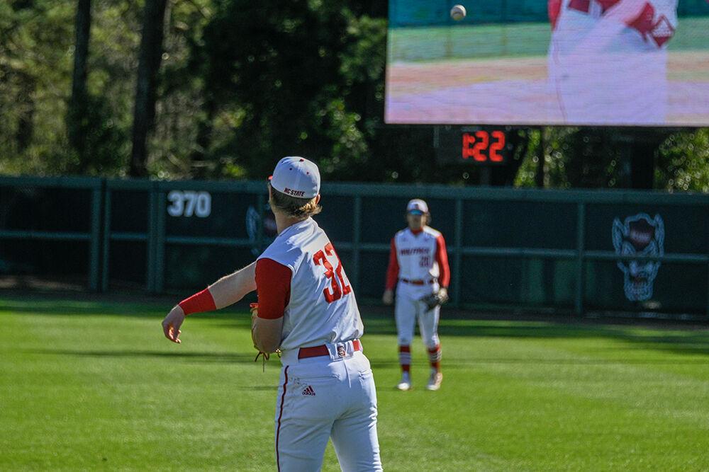 Freshman infielder Matt Heavner and freshman right-hand pitcher Derrick Smith practice between innings during the game against Wagner at Doak Field in Dail Park on Saturday, Feb 18, 2023. NC State beat Wagner 3-2 to win the series.