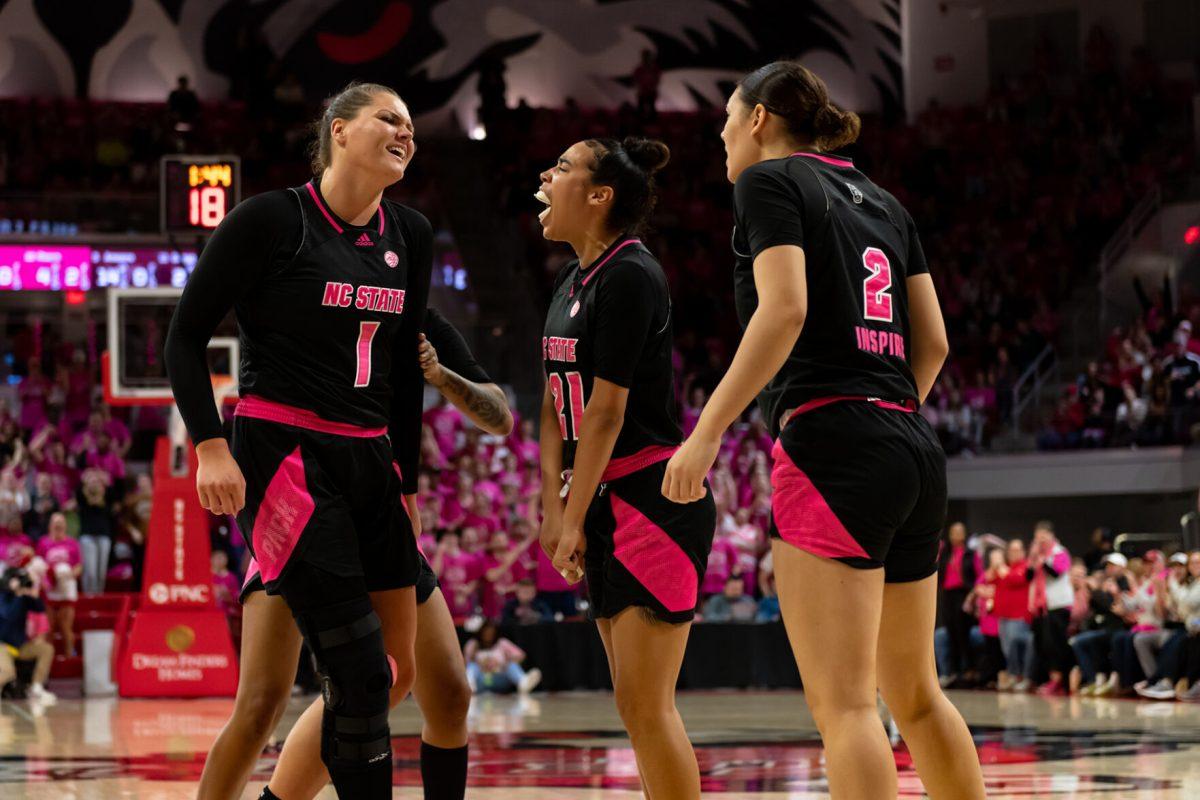 Graduate center River Baldwin, junior guard River Hayes, and graduate forward Mimi Collins celebrate scoring during the game versus Virginia Teach in Reynolds Coliseum on Monday, February 6, 2023. Baldwin and Hayes both made two field goals and Collins made one. NC State lost to Virginia Tech 73-61.