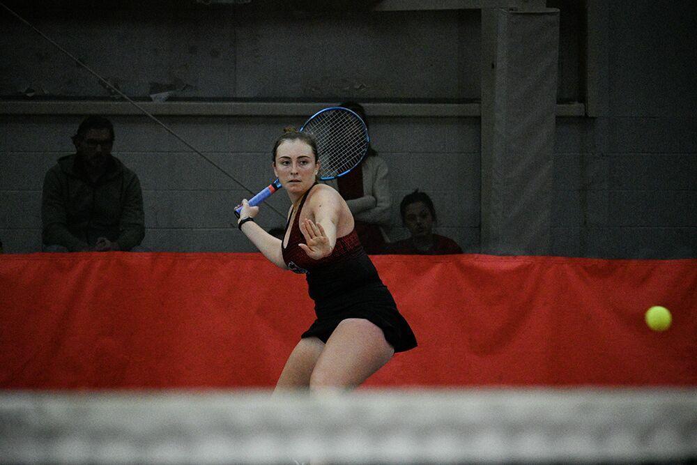 Junior Abigail Rencheli prepares to make a forehanded swing during her singles match against Oklahoma player Emma Staker at J.W. Isenhour Tennis Center on Saturday, Feb. 4, 2023. Rencheli won the singles match and NC State beat Oklahoma 6-1.