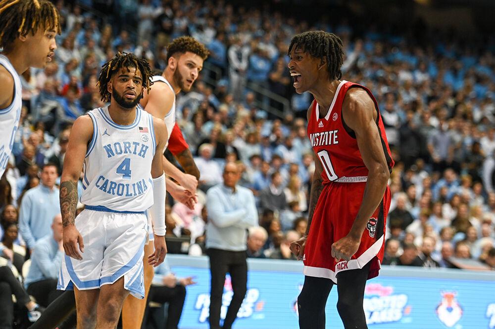 Sophomore guard Terquavion Smith yells after making a basket over the UNC-Chapel Hill defense in the Dean E. Smith Center on Saturday, Jan. 21, 2023. Smith scored 12 points for the Wolfpack before his injury in the second half. The Wolfpack lost to the Tar Heels 80-69.