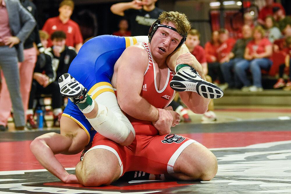 Redshirt sophomore Owen Trephan traps his opponent during the match against Pittsburg at William Neal Reynolds Coliseum on Friday, Feb. 10, 2023. Trephan won his match 3-1. NC State beat Pittsburg 23-9.