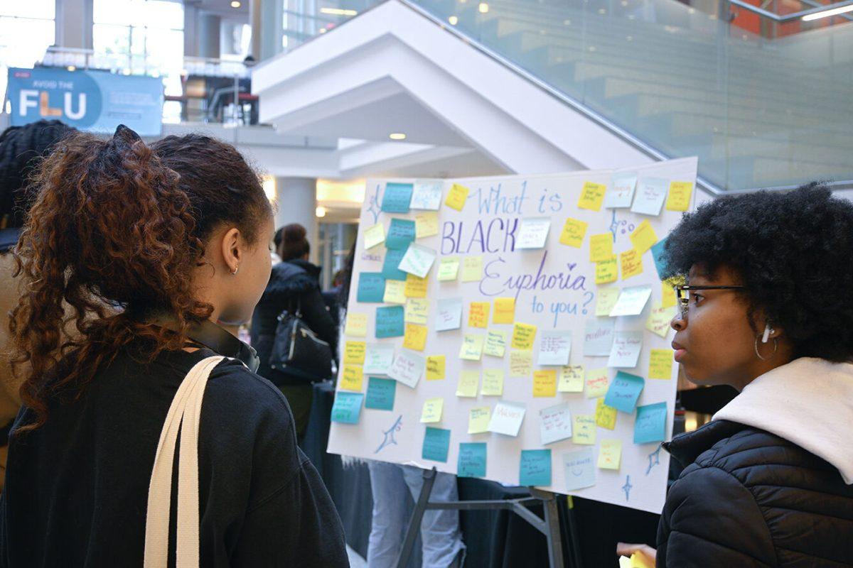 MyAsia Jackson, a second-year studying political science, and Maggie Trantham, a third-year studying fashion and textiles management, share a conversation at the Black History Month Kickoff in Talley Student Union on Feb. 1, 2023. The theme for this year's black history month is Black Euphoria.