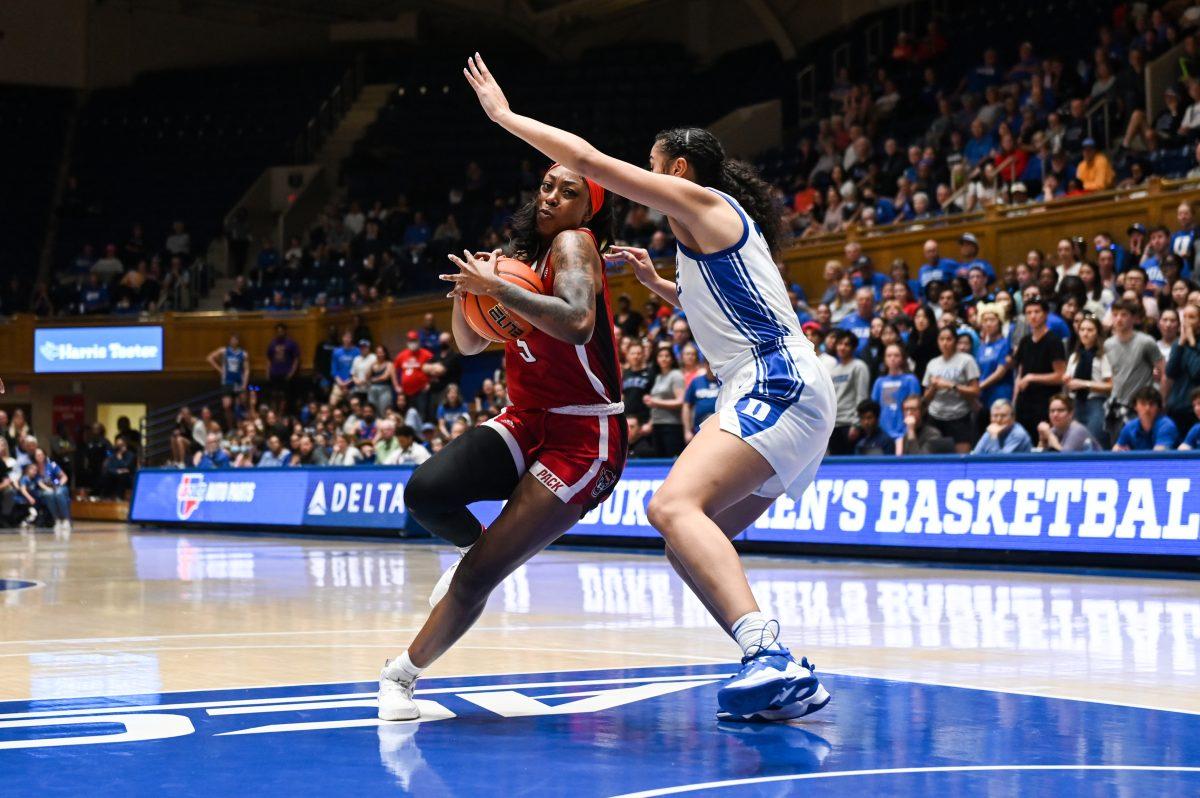 Senior forward Jada Boyd bypasses defender during the game versus Duke at Cameron Indoor Stadium on Feb. 23, 2023. Boyd made five field-goals and nine free-throws. NC State lost to Duke 77-62.