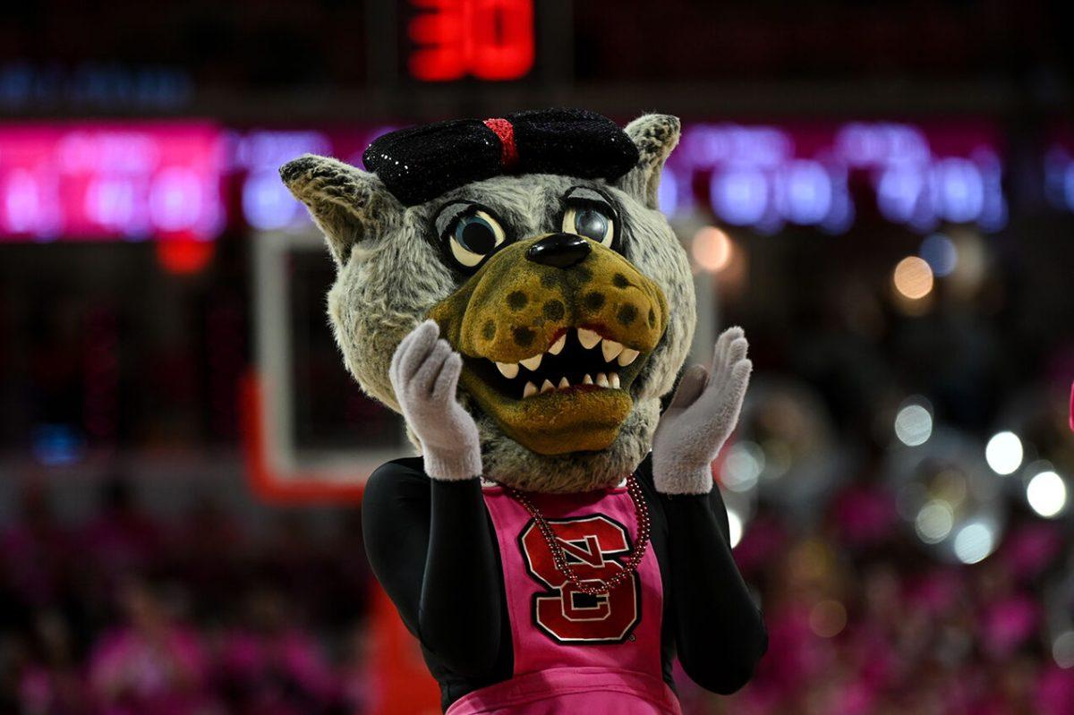 Mrs. Wuf cheers to the crowd during the game versus Virginia Teach in Reynolds Coliseum on Monday, February 6, 2023. NC State lost to Virginia Tech 73-61.
