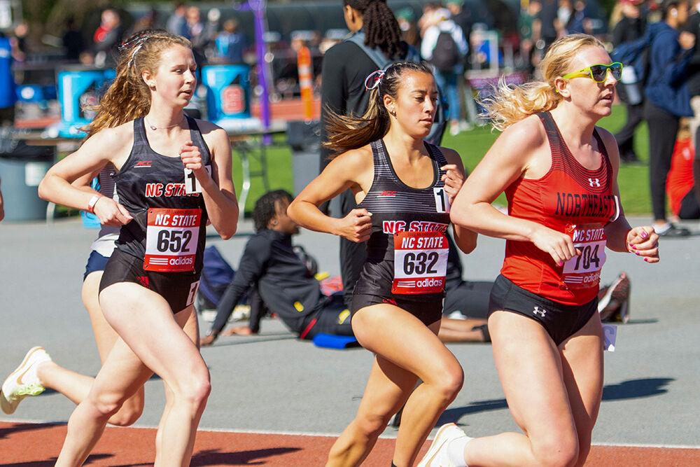 Junior Shannon Sefton (left) and Junior Lulu Black (right) round the track during the Raleigh Relays on Friday, March 25, 2022 at the Derr Track and Field Facility. Sefton placed 109th with a time of 17:14.87 and Black finished 113th with a time of 17:15.99 in the women's 5000 meter race.
