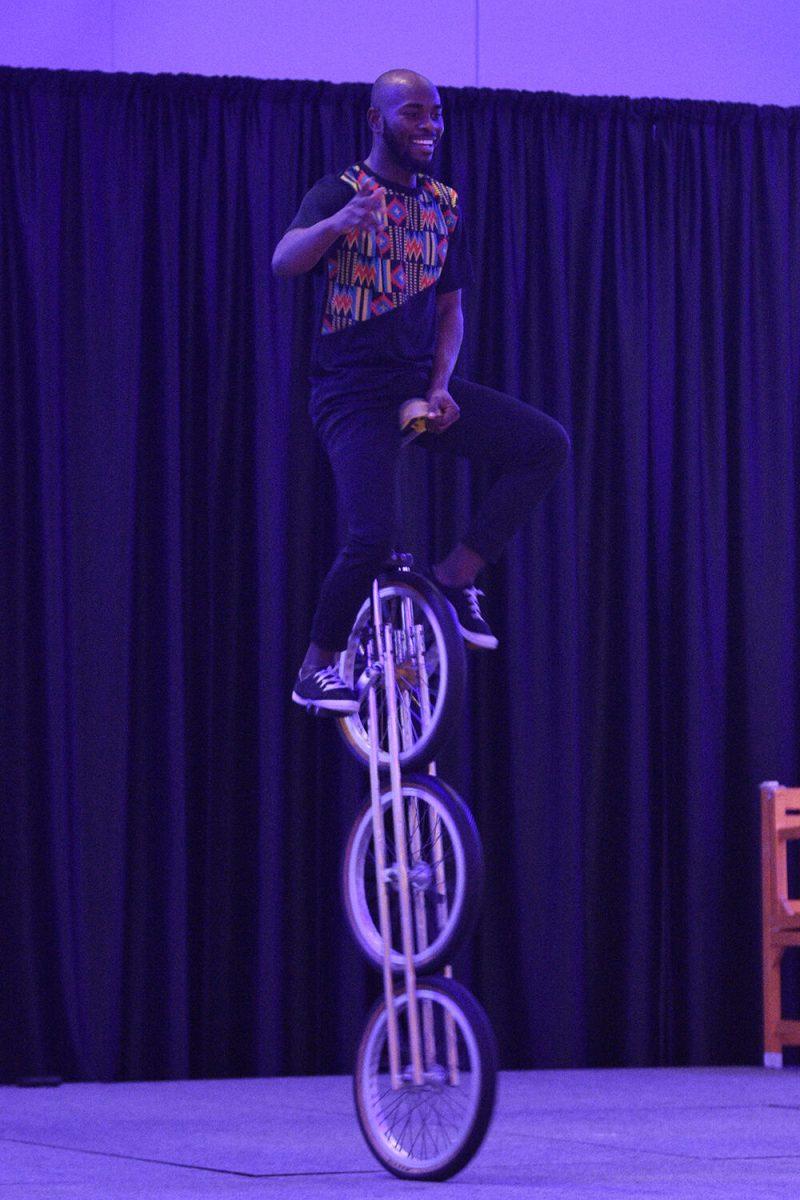 An acrobat rides a three-wheel high unicycle in the Piedmont-Mountain Ballroom in Talley Student Union on Wednesday, Feb. 8, 2023. The Zuzu Acrobats performance was organized by the Black Students Board.