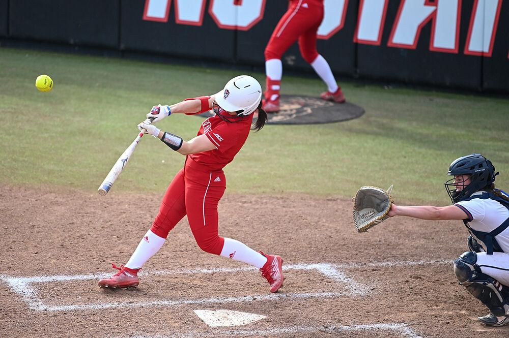 Sophomore infielder Alaina Smith swings at the ball in the game against Penn at Dail Softball Stadium on Friday, Feb. 24, 2023. The Wolfpack pulled a win over the Quakers 15-6.