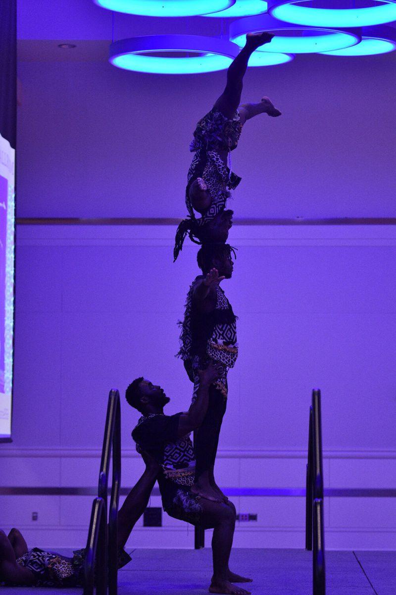 The Zuzu Acrobats balance atop one another in the Piedmont-Mountain Ballroom in Talley Student Union on Wednesday, Feb. 8, 2023. The Zuzu Acrobats perform stunts for an audience.