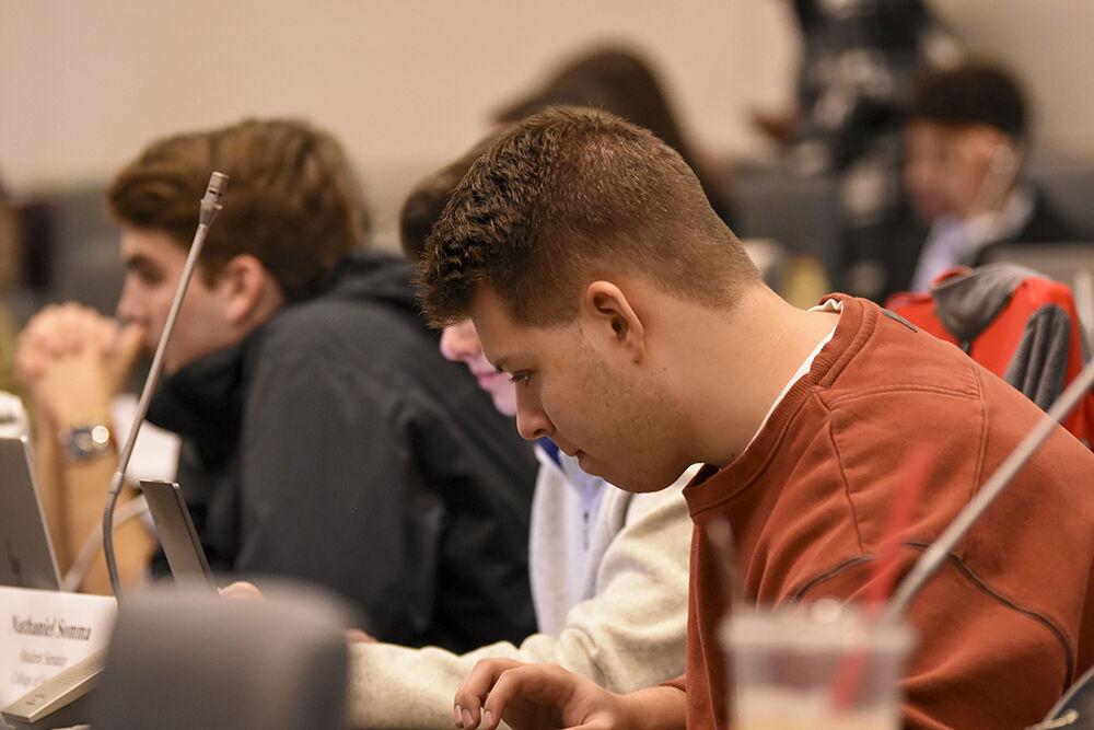 Reed Ballus, a 2nd year studying political science and economics, analyzes the meeting agenda before the 102nd Session of the North Carolina State University Student Senate at Talley Student Union on Wednesday, Feb. 1st 2023. The agenda was noted by senators to be unusually long, tackling 9 Second Readings instead of their average of 4-5.