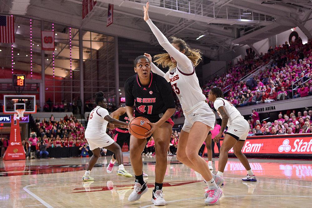 Senior center Camille Hobby protects the ball from defenders during the game against Virginia Tech at William Neal Reynolds Coliseum on Mon. Feb. 6, 2023. The Play4Kay event was held during the game as a memorial to former head coach Kay Yow and a celebration for all who have suffered from breast cancer. Virginia Tech won 73-61.