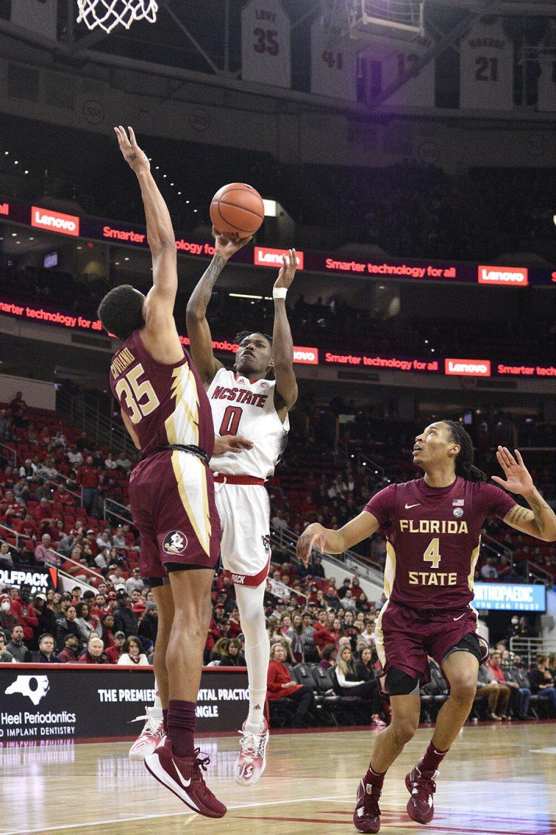 Sophomore guard Terquavion Smith shoots at the goal during the game against the Florida State Seminoles inside PNC Arena on Wednesday, Feb. 1, 2023. Smith scored 32 points with five rebounds. The Wolfpack won 94-66.