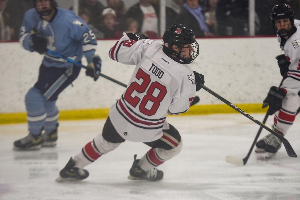 Icepack forward Logan Todd lunges for the puck during the game against UNC-Chapel Hill in Wake Competition Center on Saturday, Feb. 3, 2023. The Icepack lost to the Tar Heels 3-1.