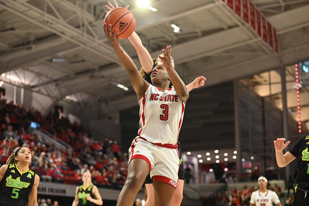 Junior guard Diamond Johnson shoots a layup during the game against USF in Reynolds Coliseum on Sunday, Dec. 11, 2022. Johnson led in scoring with 14 points. NC State beat USF 65-57.