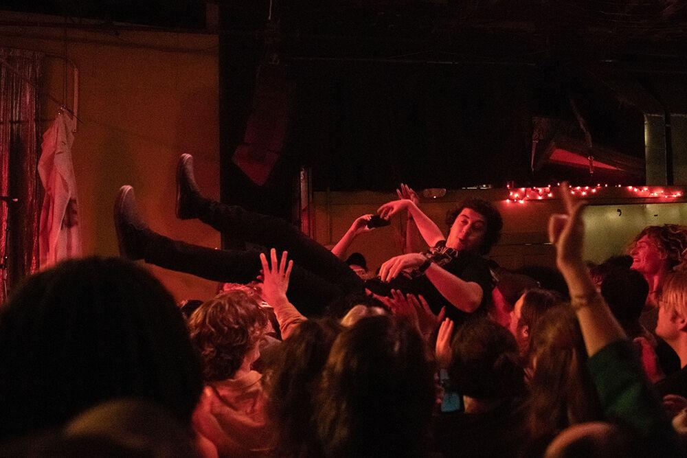 Cameron Handford, special guest of Pictures of Vernon, dives into the crowd during the Double Barrel Benefit at Kings on Saturday Feb. 4, 2023. Handford was a former member of the band but has since branched off.