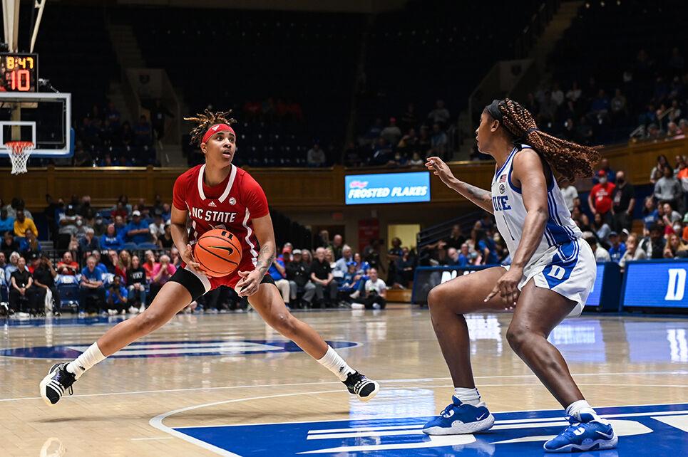 Sophomore guard Aziaha James pivots around defense during the game versus Duke at Cameron Indoor Stadium on Feb. 23, 2023. James made two field-goals. NC State lost to Duke 77-62.
