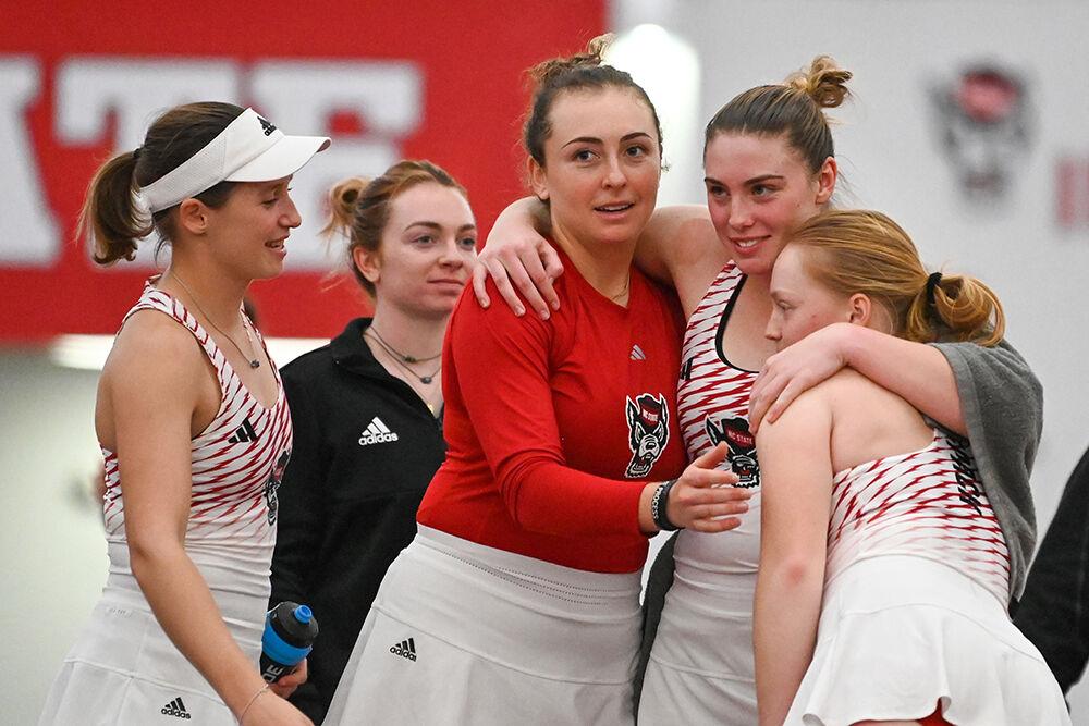 Junior Gina Dittman, junior Abigail Rencheli, junior Amelia Rajecki and junior Sophie Abrams (left to right) celebrate after a match versus Tennessee at J.W. Isenhour Tennis Center on Sunday, Feb. 5, 2023. NC State beat Tennessee 6-1.