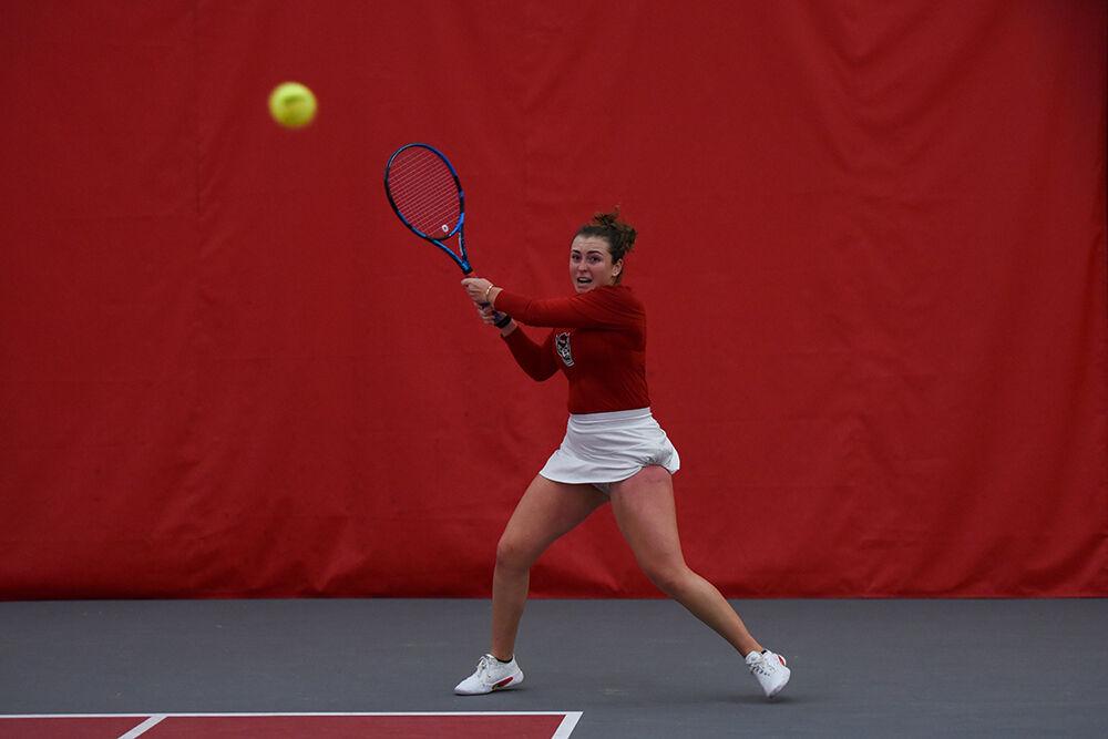 Junior Abigail Rencheli returns the ball with a backhand swing during her singles match against Tennessee player Daria Kuczer at J.W. Isenhour Tennis Center on Sunday, Feb. 5, 2023. NC State beat Tennessee 6-1.