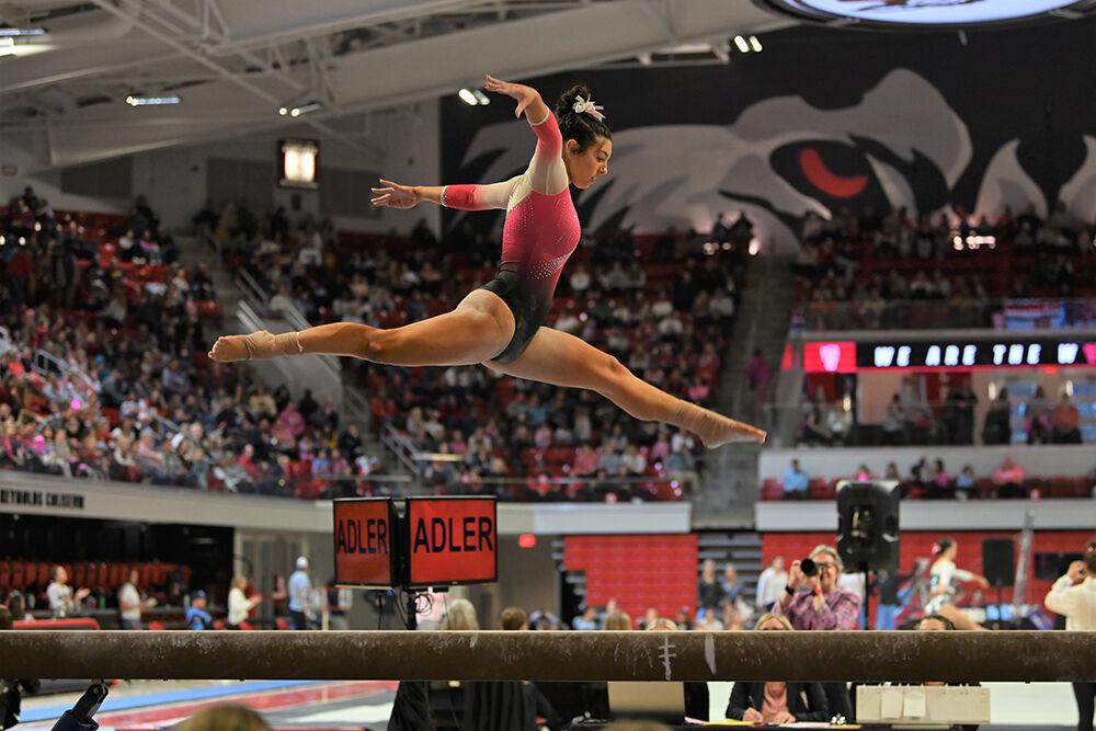 Freshman Meg Alder performs her beam routine during the meet against UNC-Chapel Hill and Western Michigan at Reynolds Coliseum on Saturday, Feb. 4, 2023. NC State won the meet with an overall score of 196.275.