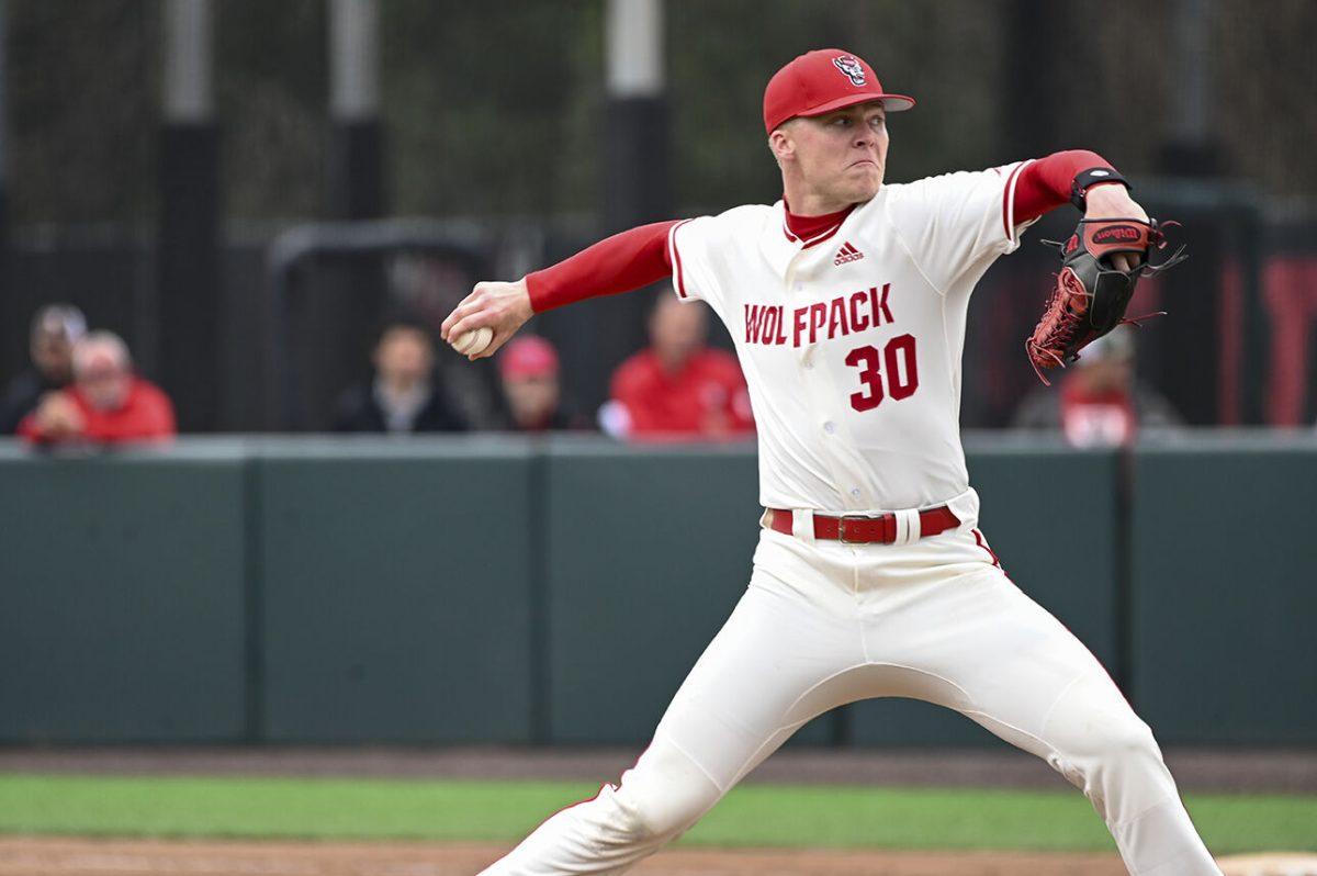 Junior pitcher Justin Lawson throws the ball during the game against Belmont at Doak Field at Dail Park on Sunday, Feb. 26, 2023. Lawson had four strikeouts. The Wolfpack beat the Bruins 7-1 with the Wolfpack sweeping the series.