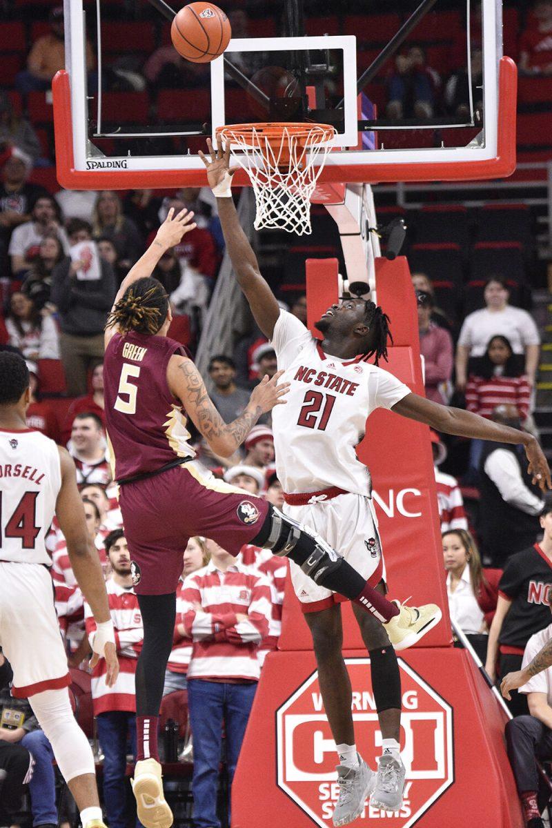Junior forward Ebenezer Dowuona attempts to block a shoot during the game against the Florida State Seminoles inside PNC Arena on Wednesday, Feb. 1, 2023. The Wolfpack won 94-66.