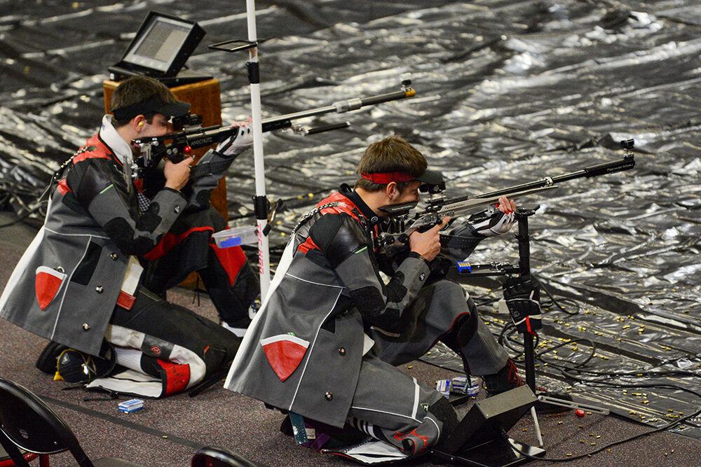 Sophomore Ben Salas and freshman Samuel Burrow aim at their targets in the competition against WVU on Sunday, Oct. 16, 2021 in Reynolds Coliseum.NC State lost to West Virginia 4730-4652.