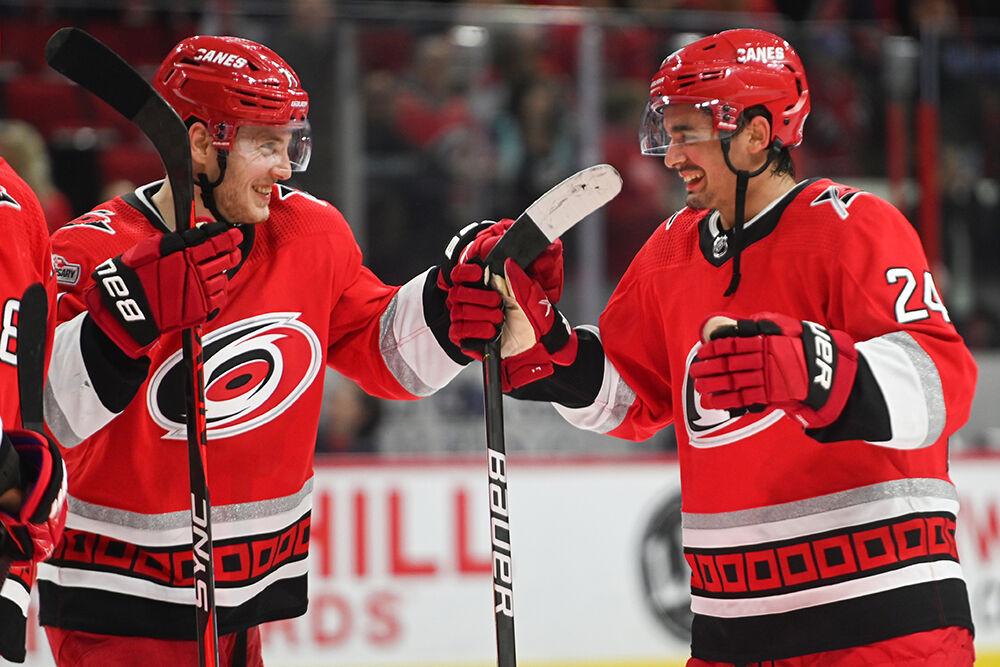 Carolina Hurricanes right wing Jesper Fast and Carolina Hurricanes Seth Jarvis celebrate after the game against the Montreal Canadiens ended in PNC Arena on Thursday, Feb. 16, 2023. Jarvis scored three goals, successfully completing a hat trick. The Hurricanes won 6-2.