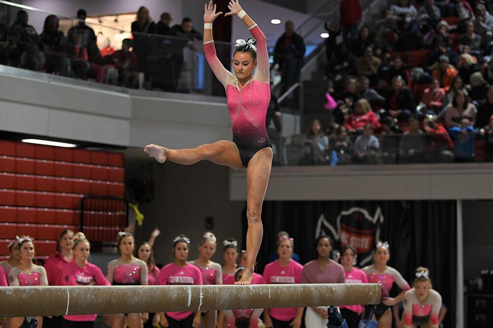 Senior Emily Shepard performs her beam routine during the meet against UNC-Chapel Hill and Western Michigan at Reynolds Coliseum on Saturday, Feb. 4, 2023. NC State won the meet with an overall score of 196.275.