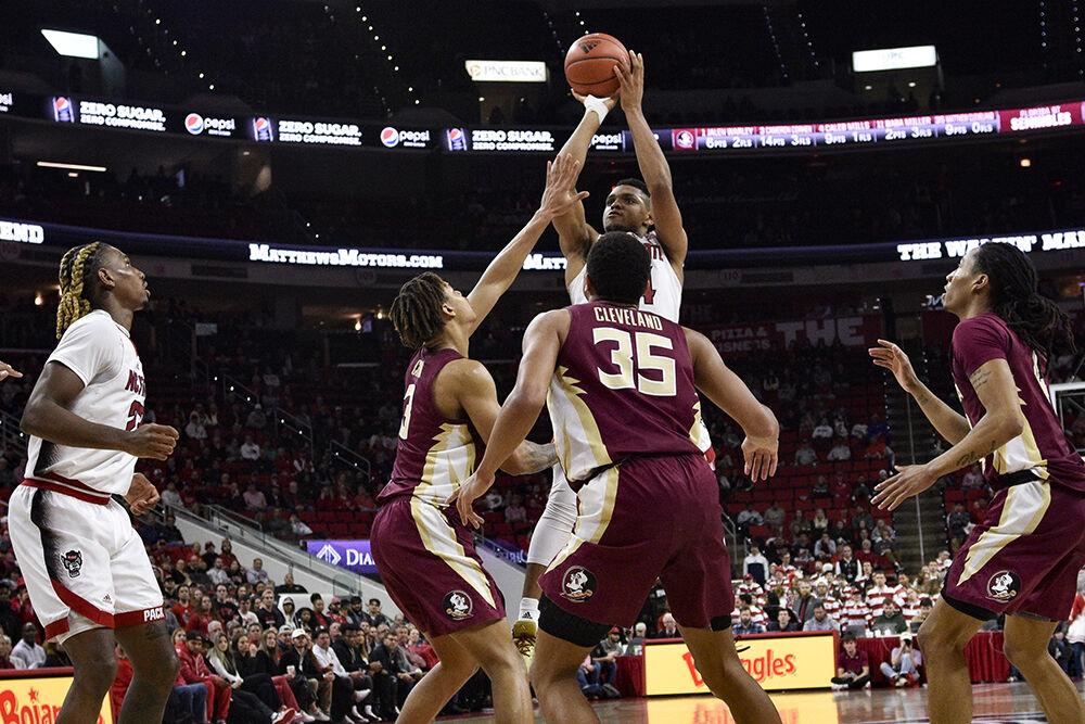 Senior guard Casey Morsell shoots at the goal during the game against the Florida State Seminoles inside PNC Arena on Wednesday, Feb. 1, 2023. Morsell had 10 points with seven rebounds. The Wolfpack won 94-66.
