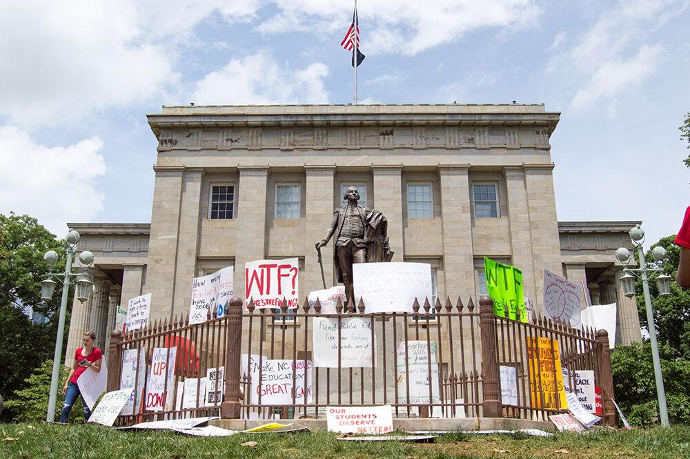 Raleigh's statue of George Washington overlooks the Capitol Building on Wednesday, May 16, 2018.