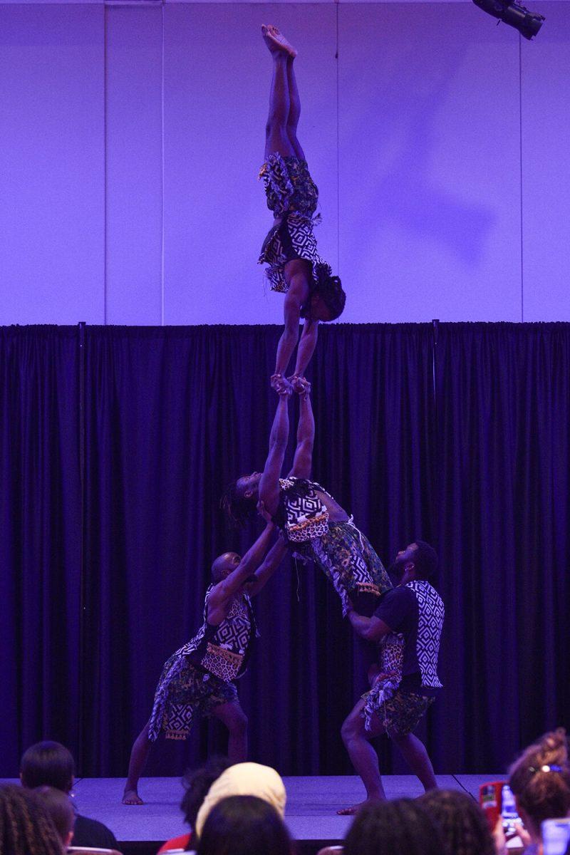 The Zuzu Acrobats balance atop one another to form a human pyramid in the Piedmont-Mountain Ballroom in Talley Student Union on Wednesday, Feb. 8, 2023. The Zuzu Acrobats perform stunts for an audience.