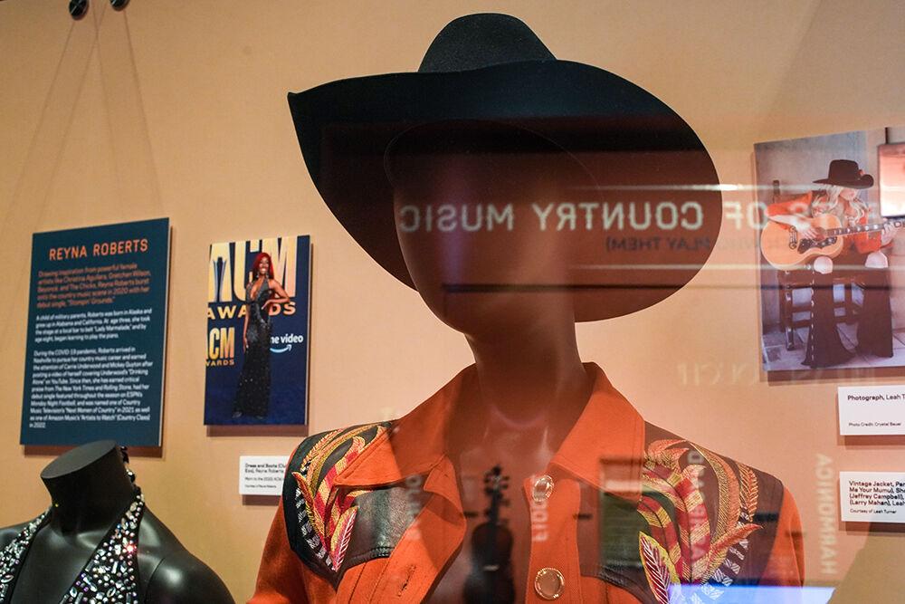Memorabilia from contemporary country music artists Reyna Roberts, left, and Leah Turner feature in The Power of Women in Country Music exhibit at the NC Museum of History on Friday, Feb. 3, 2023.