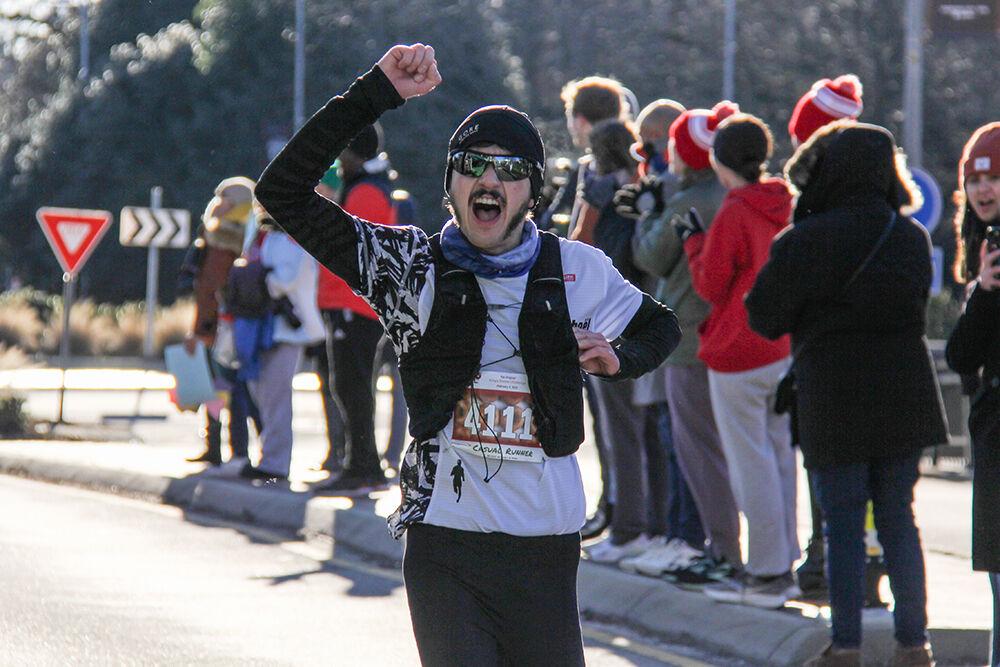 Rapha&#235;l Borderies completes the race during the Krispy Kreme Challenge on Hillsborough Street on Feb. 4, 2023. The challenge is an annual charity event where participants attempt to run five miles and eat a dozen donuts at the midpoint of the race, all within an hour. Borderies was the first non-challenger to complete the race, with a chip time of 29:41 minutes. When asked about his donut-eating strategy, he stated he "Gave them to the spectators" and kept running.