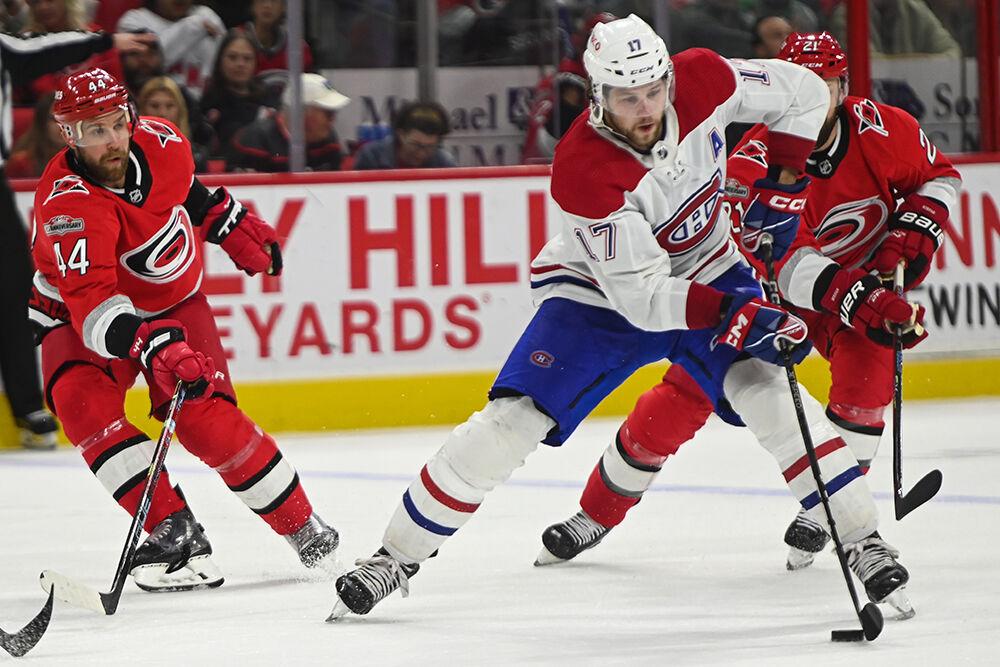 Carolina Hurricanes defenseman Calvin de Haan defends opponent during the game against the Montreal Canadiens in PNC Arena on Thursday, Feb. 16, 2023. The Hurricanes won 6-2.