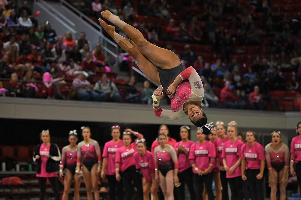 Senior Alexis Ortega performs the last pass in the floor routine during the meet against UNC-Chapel Hill and Western Michigan at Reynolds Coliseum on Saturday, Feb. 4, 2023. NC State won the meet with an overall score of 196.275.
